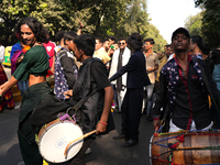 Members of the LGBT community dance on drums during the pride march in New Delhi, India, on November 24, 2024. (