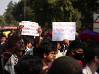 Supporters of the LGBT community hold placards in support of Kashmir and Palestine during the pride march in New Delhi, India, on November 2...