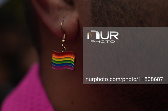 A member of the LGBT community wears a rainbow earring during the pride march in New Delhi, India, on November 24, 2024. 