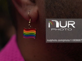 A member of the LGBT community wears a rainbow earring during the pride march in New Delhi, India, on November 24, 2024. (