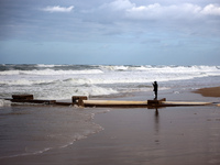 A Palestinian boy stands on the seashore after heavy rainfall in Deir al-Balah, central Gaza Strip, on November 25, 2024, amid the ongoing w...