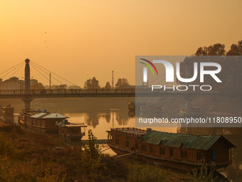 People walk over a bridge in Srinagar, Jammu and Kashmir, on November 25, 2024. (