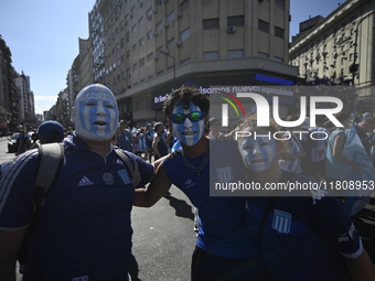 Supporters of Racing Club celebrate the victory of the 2024 Copa Sudamericana in Buenos Aires, Argentina, on November 24, 2024. A massive ga...