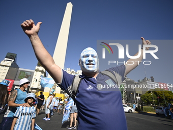 Supporters of Racing Club celebrate the victory of the 2024 Copa Sudamericana in Buenos Aires, Argentina, on November 24, 2024. A massive ga...