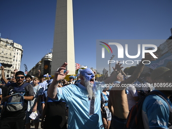 Supporters of Racing Club celebrate the victory of the 2024 Copa Sudamericana in Buenos Aires, Argentina, on November 24, 2024. A massive ga...