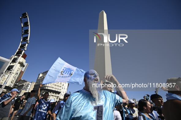 Supporters of Racing Club celebrate the victory of the 2024 Copa Sudamericana in Buenos Aires, Argentina, on November 24, 2024. A massive ga...