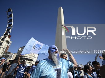 Supporters of Racing Club celebrate the victory of the 2024 Copa Sudamericana in Buenos Aires, Argentina, on November 24, 2024. A massive ga...