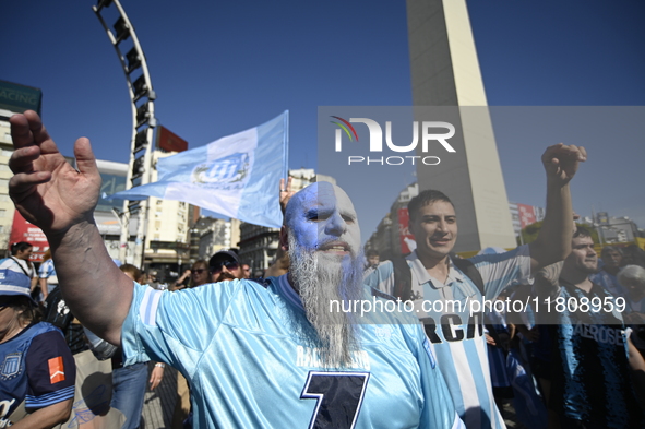 Supporters of Racing Club celebrate the victory of the 2024 Copa Sudamericana in Buenos Aires, Argentina, on November 24, 2024. A massive ga...