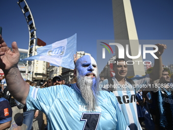 Supporters of Racing Club celebrate the victory of the 2024 Copa Sudamericana in Buenos Aires, Argentina, on November 24, 2024. A massive ga...