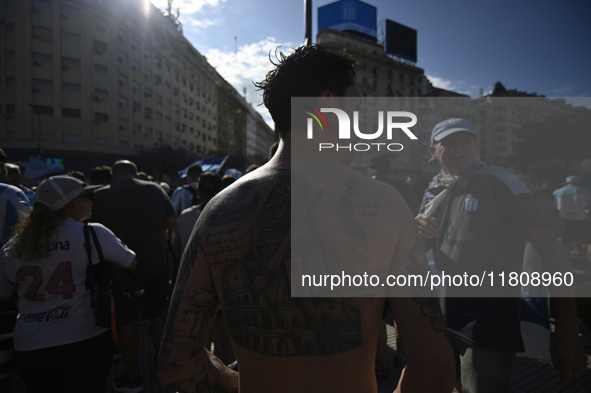 Supporters of Racing Club celebrate the victory of the 2024 Copa Sudamericana in Buenos Aires, Argentina, on November 24, 2024. A massive ga...