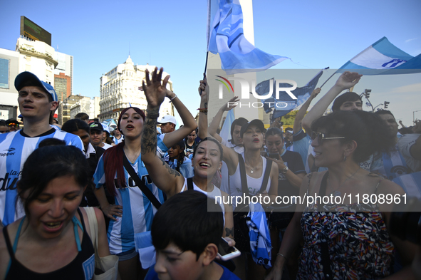 Supporters of Racing Club celebrate the victory of the 2024 Copa Sudamericana in Buenos Aires, Argentina, on November 24, 2024. A massive ga...