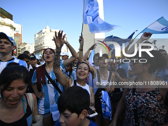 Supporters of Racing Club celebrate the victory of the 2024 Copa Sudamericana in Buenos Aires, Argentina, on November 24, 2024. A massive ga...