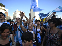 Supporters of Racing Club celebrate the victory of the 2024 Copa Sudamericana in Buenos Aires, Argentina, on November 24, 2024. A massive ga...