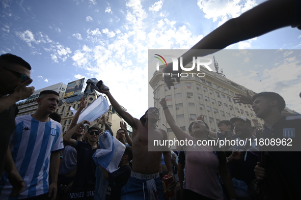 Supporters of Racing Club celebrate the victory of the 2024 Copa Sudamericana in Buenos Aires, Argentina, on November 24, 2024. A massive ga...