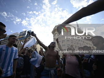 Supporters of Racing Club celebrate the victory of the 2024 Copa Sudamericana in Buenos Aires, Argentina, on November 24, 2024. A massive ga...