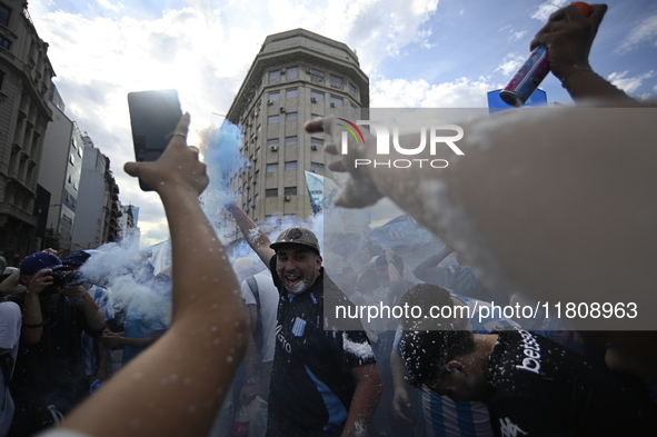 Supporters of Racing Club celebrate the victory of the 2024 Copa Sudamericana in Buenos Aires, Argentina, on November 24, 2024. A massive ga...