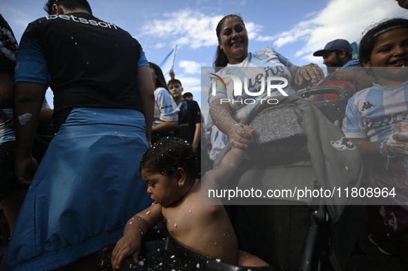 Supporters of Racing Club celebrate the victory of the 2024 Copa Sudamericana in Buenos Aires, Argentina, on November 24, 2024. A massive ga...