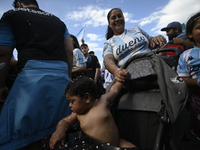 Supporters of Racing Club celebrate the victory of the 2024 Copa Sudamericana in Buenos Aires, Argentina, on November 24, 2024. A massive ga...