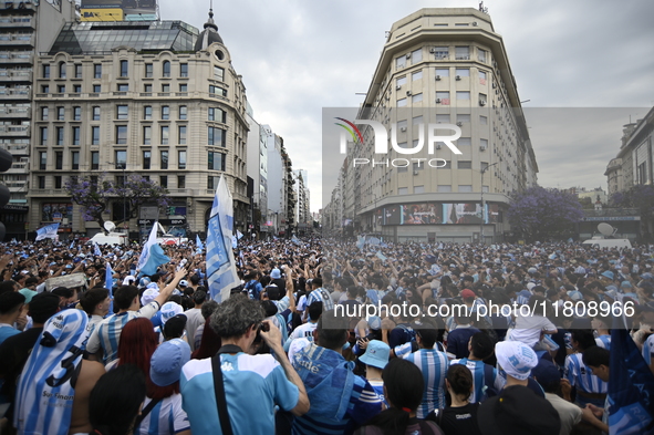 Supporters of Racing Club celebrate the victory of the 2024 Copa Sudamericana in Buenos Aires, Argentina, on November 24, 2024. A massive ga...