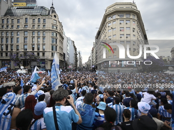 Supporters of Racing Club celebrate the victory of the 2024 Copa Sudamericana in Buenos Aires, Argentina, on November 24, 2024. A massive ga...