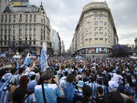 Supporters of Racing Club celebrate the victory of the 2024 Copa Sudamericana in Buenos Aires, Argentina, on November 24, 2024. A massive ga...