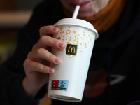 A person drinks in McDonald's restaurant in Poland on November 24, 2024. (