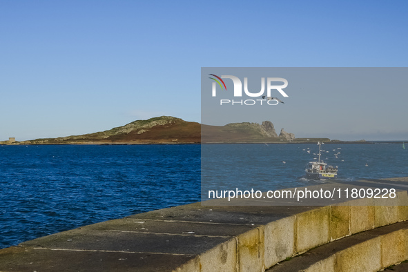 A fishing boat goes out fishing in Howth, Ireland, on November 2024. 