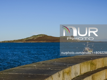 A fishing boat goes out fishing in Howth, Ireland, on November 2024. (