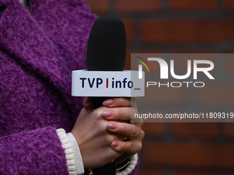 KRAKOW, POLAND - NOVEMBER 24:
A TVP Info microphone held by a TV reporter outside the venue where Karol Nawrocki was officially introduced a...