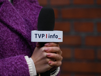 KRAKOW, POLAND - NOVEMBER 24:
A TVP Info microphone held by a TV reporter outside the venue where Karol Nawrocki was officially introduced a...