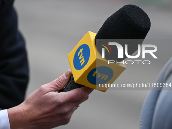 KRAKOW, POLAND - NOVEMBER 24:
A TVN microphone held by a TV reporter outside the venue where Karol Nawrocki was officially introduced as the...