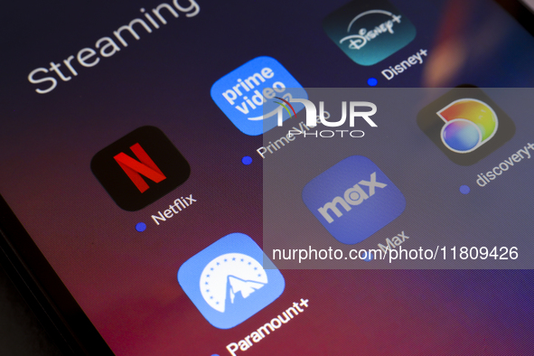 The streaming services Netflix, Amazon Prime Video, Disney Plus, Paramount Plus, Max, and Discovery Plus app soon appear on the screen of a...
