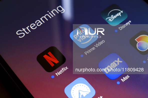 The streaming services Netflix, Amazon Prime Video, Disney Plus, Paramount Plus, Max, and Discovery Plus app soon appear on the screen of a...