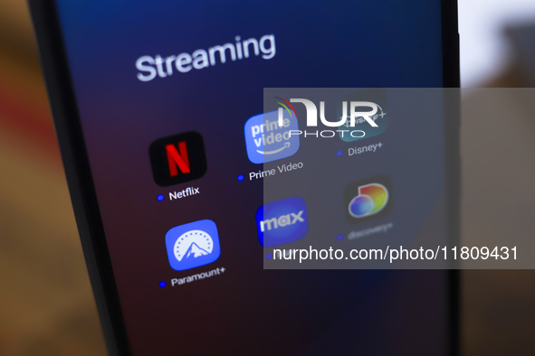 The streaming services Netflix, Amazon Prime Video, Disney Plus, Paramount Plus, Max, and Discovery Plus app soon appear on the screen of a...