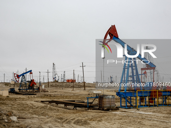 A field of small oil wells is seen in Zabrat, near Baku, Azerbaijan on November 25, 2024. Oil and gas extraction plants are densly installed...