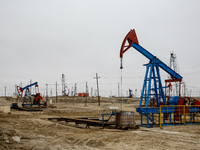 A field of small oil wells is seen in Zabrat, near Baku, Azerbaijan on November 25, 2024. Oil and gas extraction plants are densly installed...