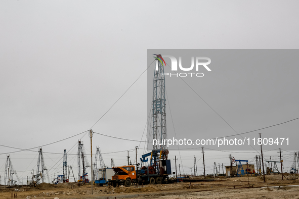 A field of small oil wells is seen in Zabrat, near Baku, Azerbaijan on November 25, 2024. Oil and gas extraction plants are densly installed...