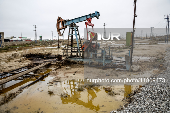 A field of small oil wells is seen in Zabrat, near Baku, Azerbaijan on November 25, 2024. Oil and gas extraction plants are densly installed...