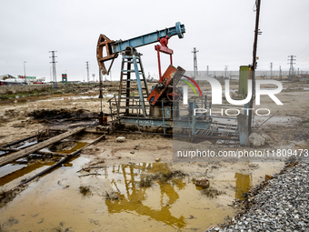 A field of small oil wells is seen in Zabrat, near Baku, Azerbaijan on November 25, 2024. Oil and gas extraction plants are densly installed...