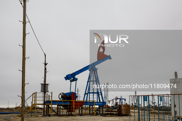 A field of small oil wells is seen in Zabrat, near Baku, Azerbaijan on November 25, 2024. Oil and gas extraction plants are densly installed...