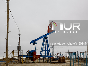 A field of small oil wells is seen in Zabrat, near Baku, Azerbaijan on November 25, 2024. Oil and gas extraction plants are densly installed...