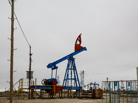 A field of small oil wells is seen in Zabrat, near Baku, Azerbaijan on November 25, 2024. Oil and gas extraction plants are densly installed...