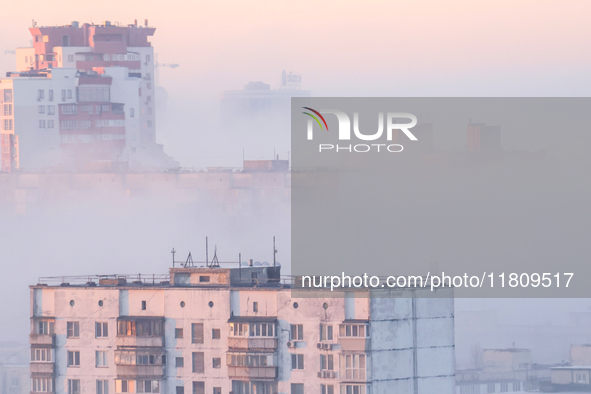 High-rise buildings are seen through the dense fog in Kyiv, Ukraine, on November 25, 2024. NO USE RUSSIA. NO USE BELARUS. 