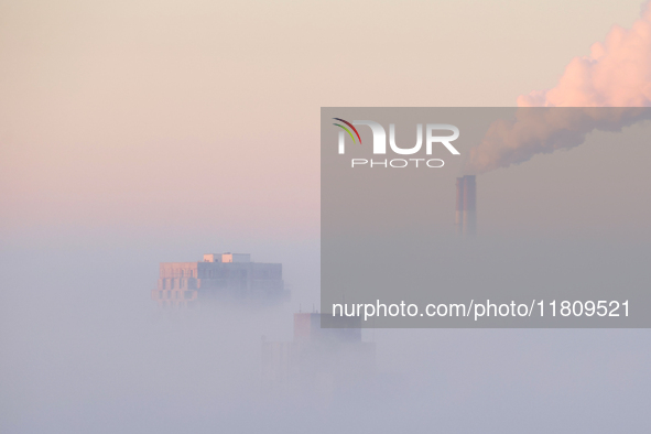 High-rise buildings are seen through the dense fog in Kyiv, Ukraine, on November 25, 2024. NO USE RUSSIA. NO USE BELARUS. 