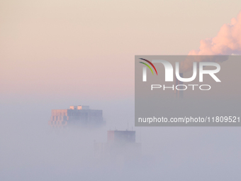 High-rise buildings are seen through the dense fog in Kyiv, Ukraine, on November 25, 2024. NO USE RUSSIA. NO USE BELARUS. (