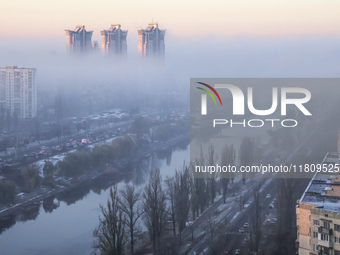 Fog hovers over the Rusanivka district in Kyiv, Ukraine, on November 25, 2024. (