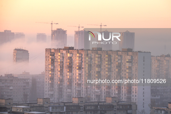 High-rise buildings are seen through the dense fog in Kyiv, Ukraine, on November 25, 2024. NO USE RUSSIA. NO USE BELARUS. 