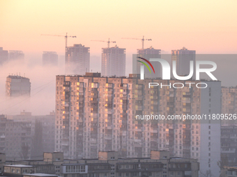 High-rise buildings are seen through the dense fog in Kyiv, Ukraine, on November 25, 2024. NO USE RUSSIA. NO USE BELARUS. (