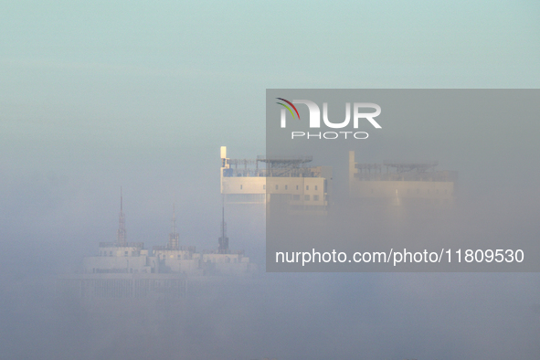 High-rise buildings are seen through the dense fog in Kyiv, Ukraine, on November 25, 2024. NO USE RUSSIA. NO USE BELARUS. 