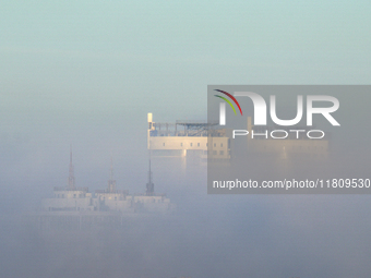 High-rise buildings are seen through the dense fog in Kyiv, Ukraine, on November 25, 2024. NO USE RUSSIA. NO USE BELARUS. (